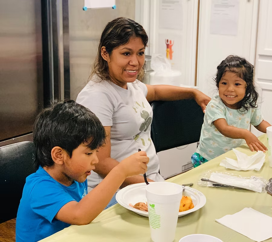 Children and families learning together at Village of Promise