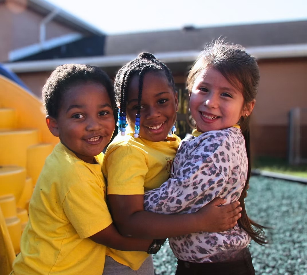 Three Village of Promise children smiling together