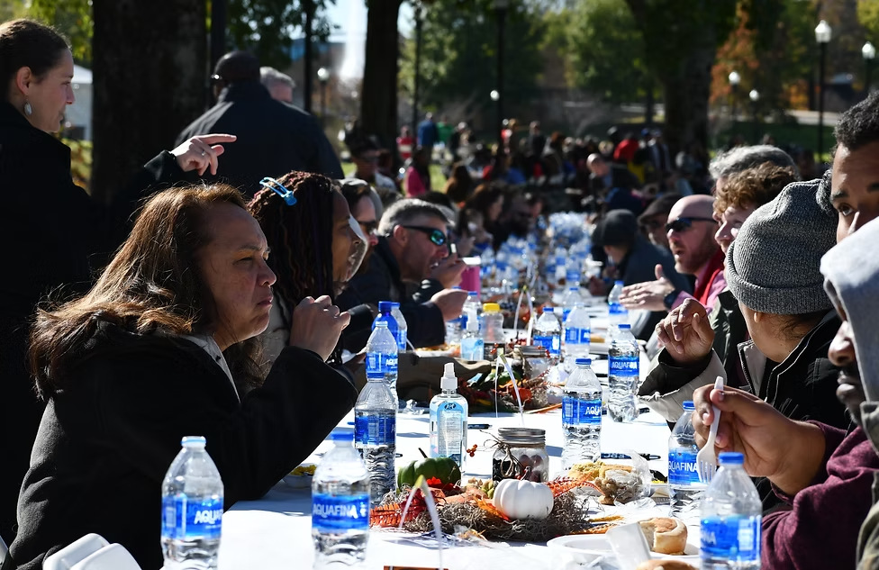 Guests dining together at One Table Huntsville